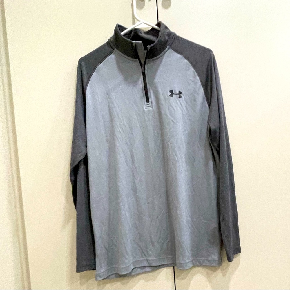 Under Armour mock neck called 1/4 zip heat gear dry fit long sleeve. Loose Fit